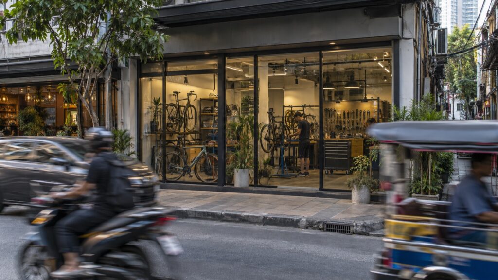 The frontage of a bicycle service workshop on a Bangkok street
