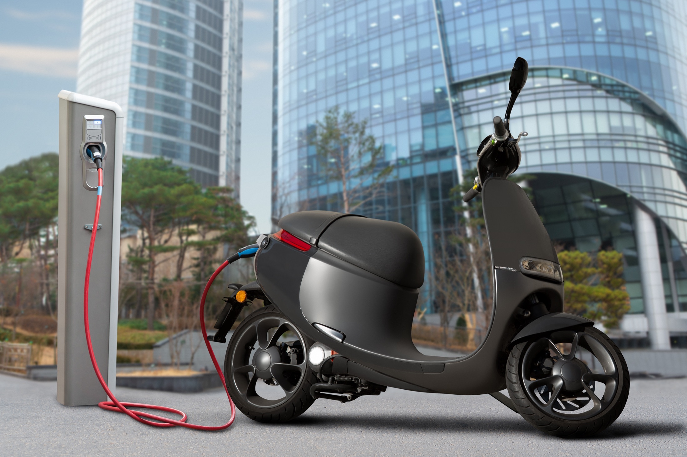 Electric scooters at a city charging station